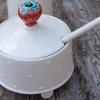 Strawberry jam pot with scroll feet and spoon